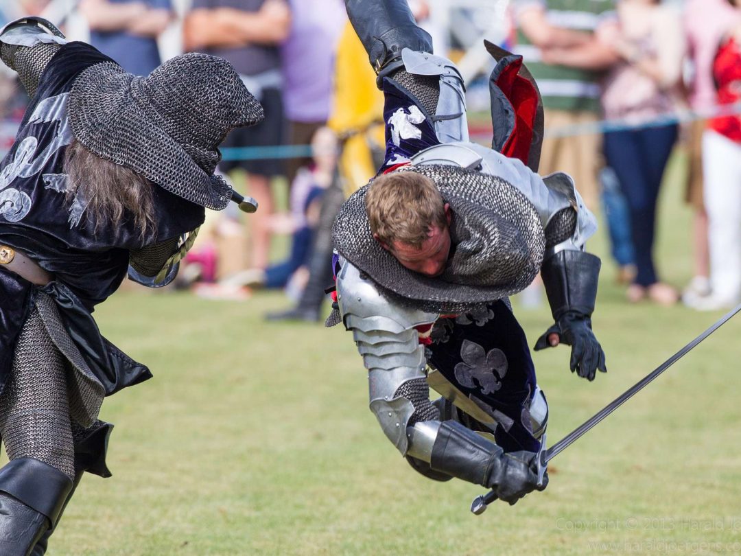 Two armoured combatants fighting on foot during a jousting display
