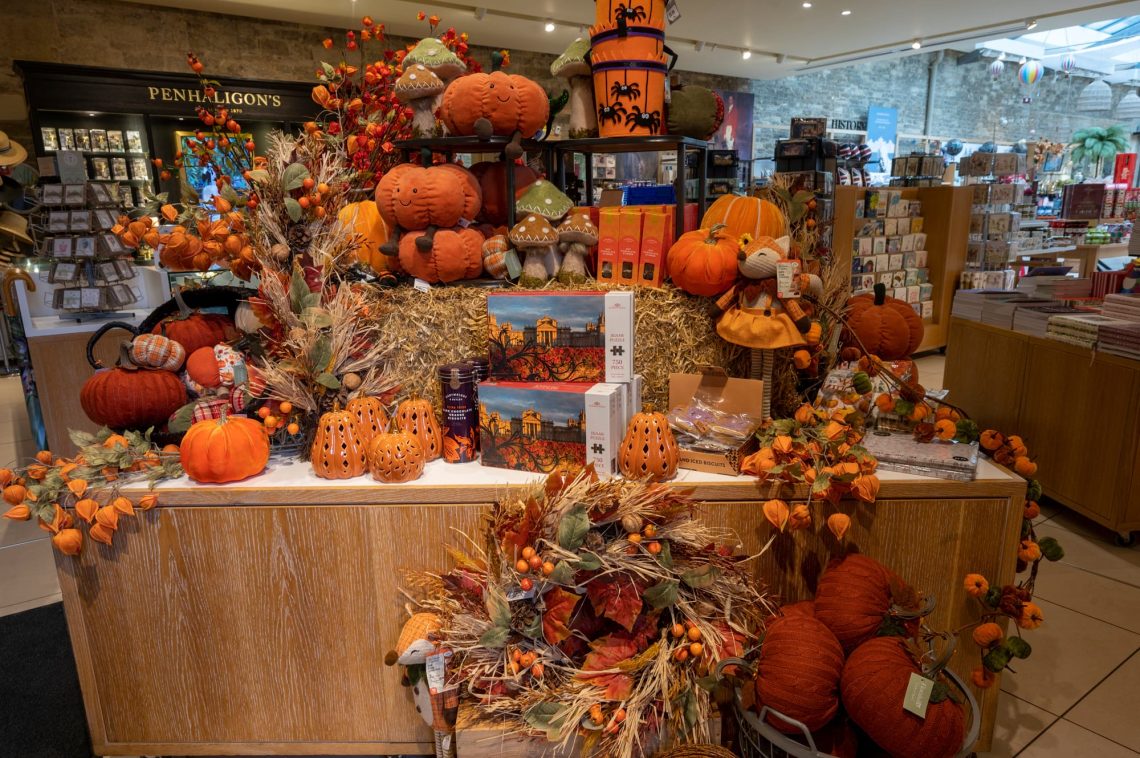 A display of plush pumpkins, autumn foliage and gifts in the Blenheim Palace shop