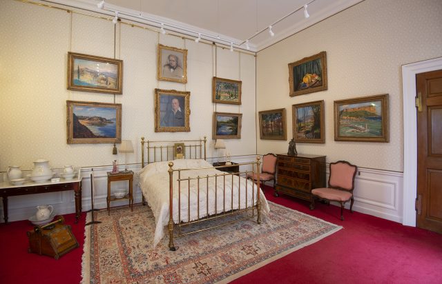 The room where Sir Winston Churchill was born, with its brass bedstead and framed paintings