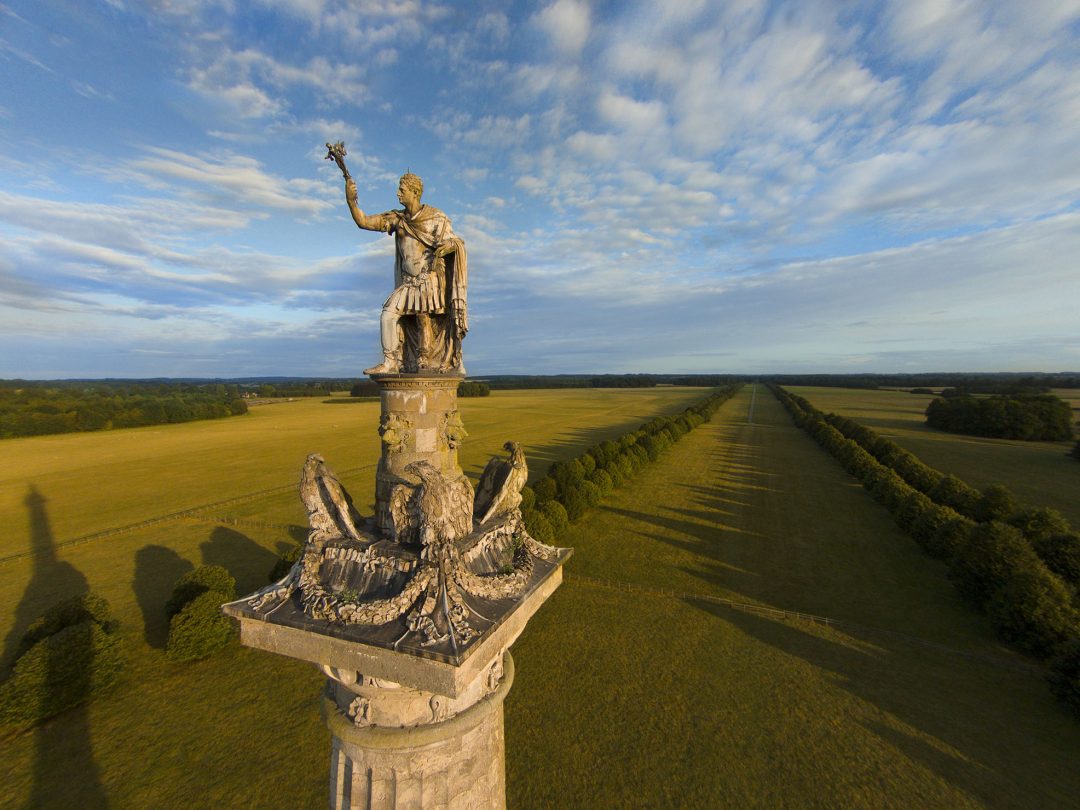 The lead statue of the 1st Duke of Marlborough atop the Column of Victory, with the Great Avenue beyond