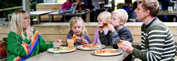 Family eating a pizza in the Walled garden