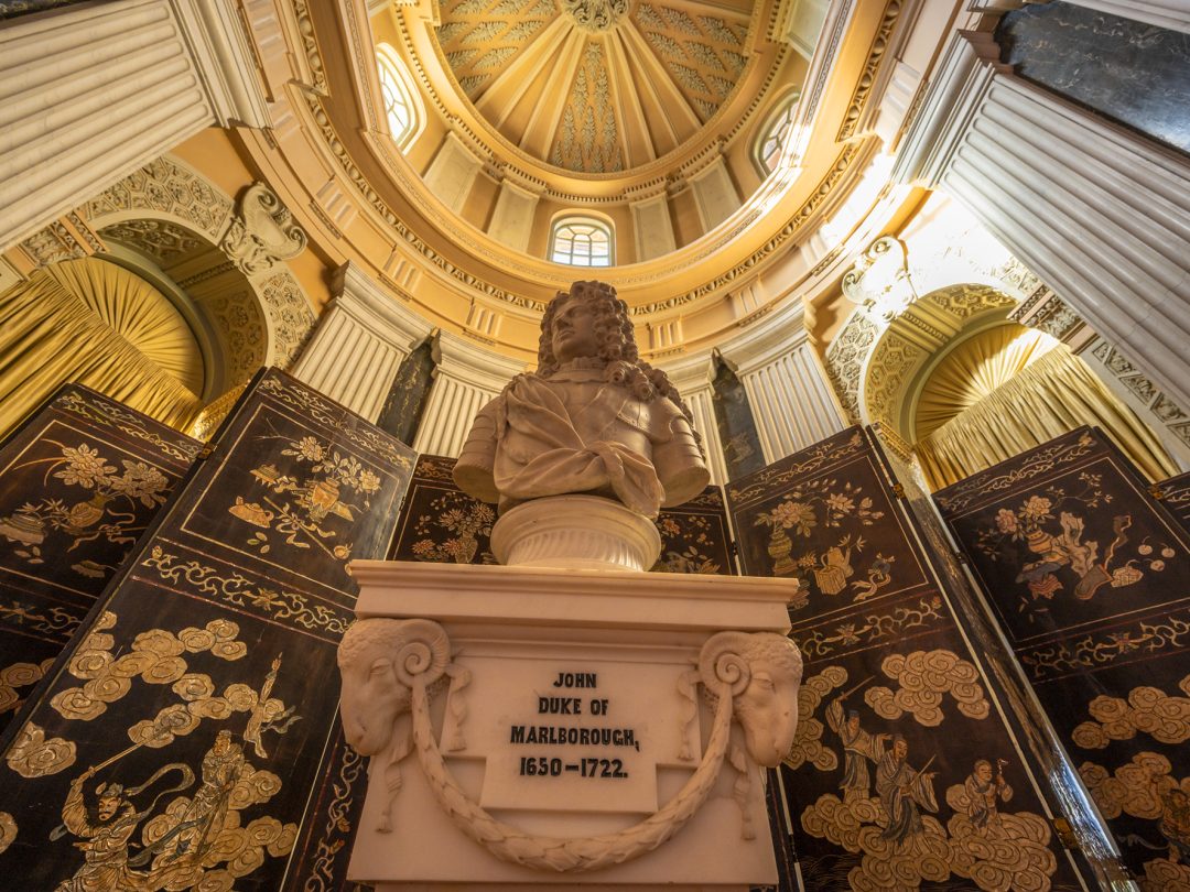 The marble bust of John, 1st Duke of Marlborough on its inscribed pedestal beneath a domed ceiling