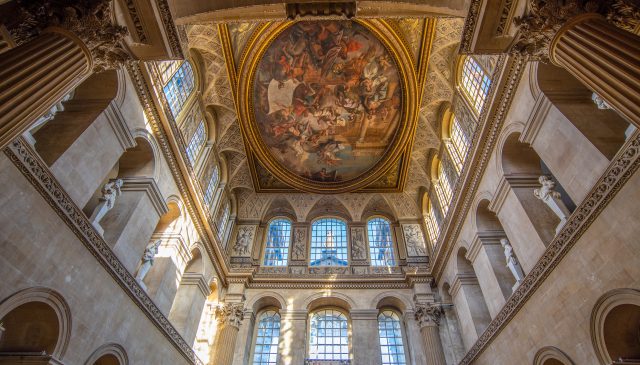 Sir James Thornhill's painted ceiling in the Great Hall, seen from below between the Corinthian columns