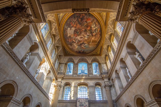 Sir James Thornhill's painted ceiling in the Great Hall, seen from below between the Corinthian columns