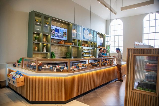 The servery counter inside the Oxfordshire Pantry, with staff serving a customer