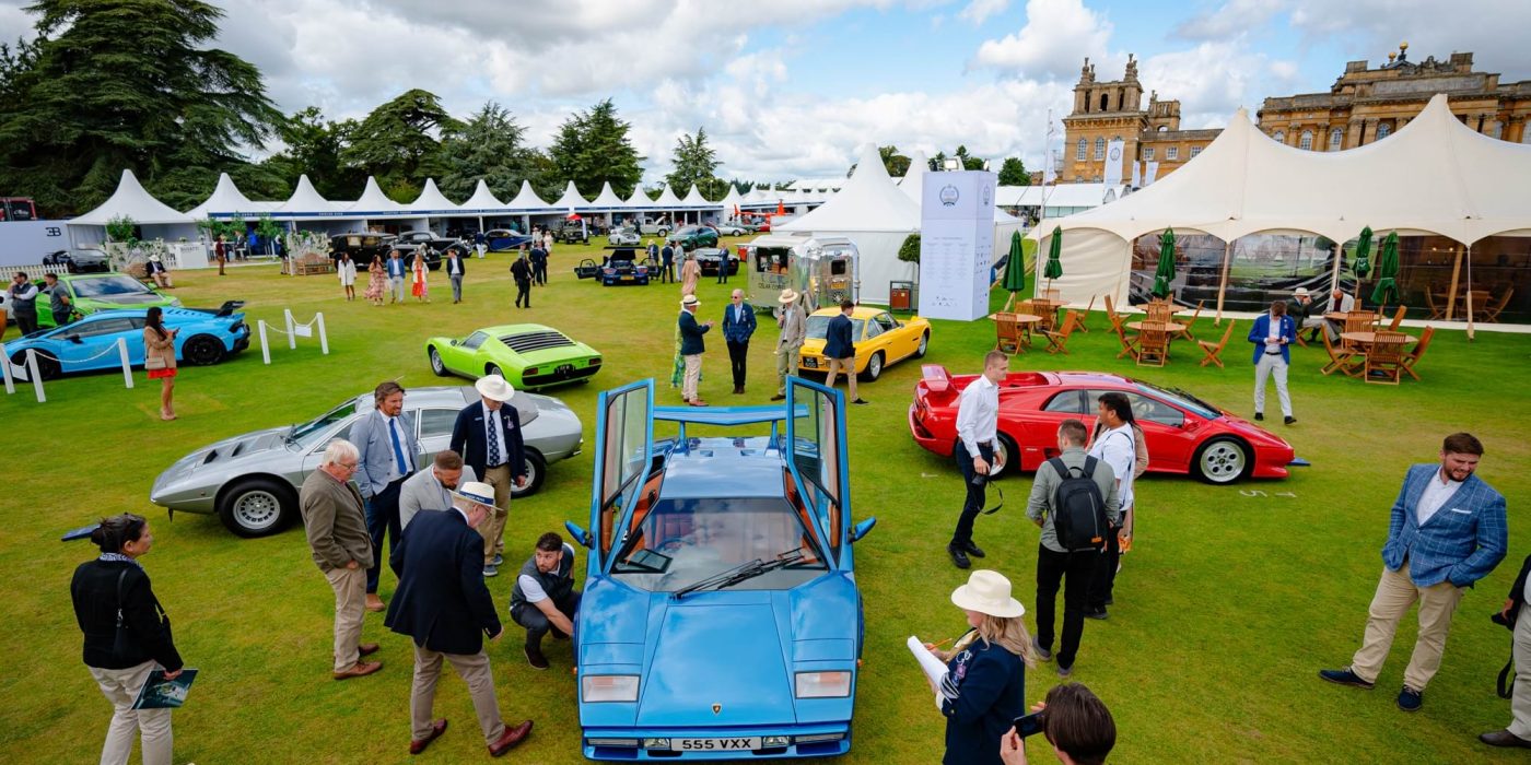 Classic sports cars displayed on the lawn in front of the Palace at Salon Prive