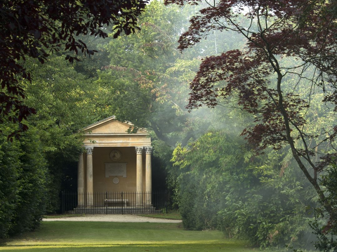 The Temple of Health at the end of a shaded grass walk