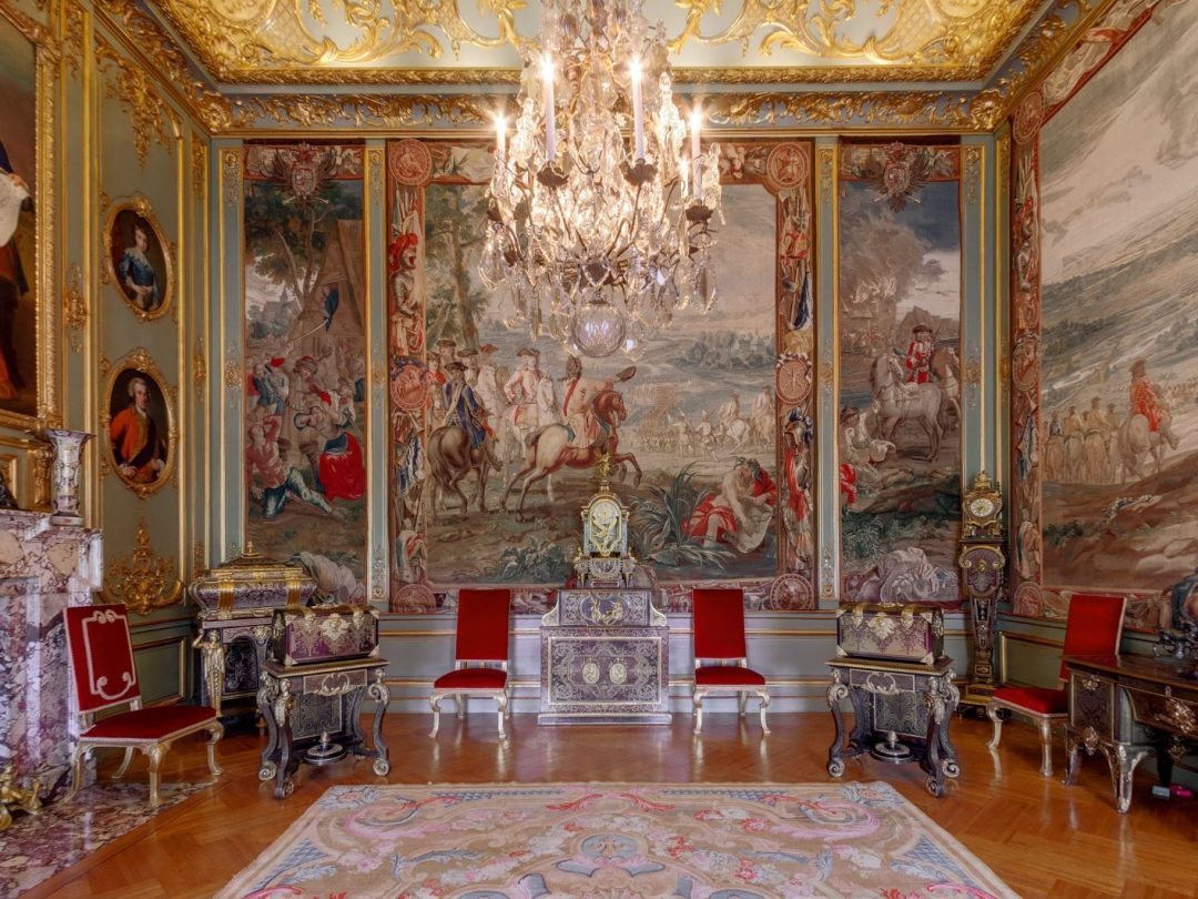 The Third State Room, hung with the Marlborough tapestries and furnished with red and gilt chairs