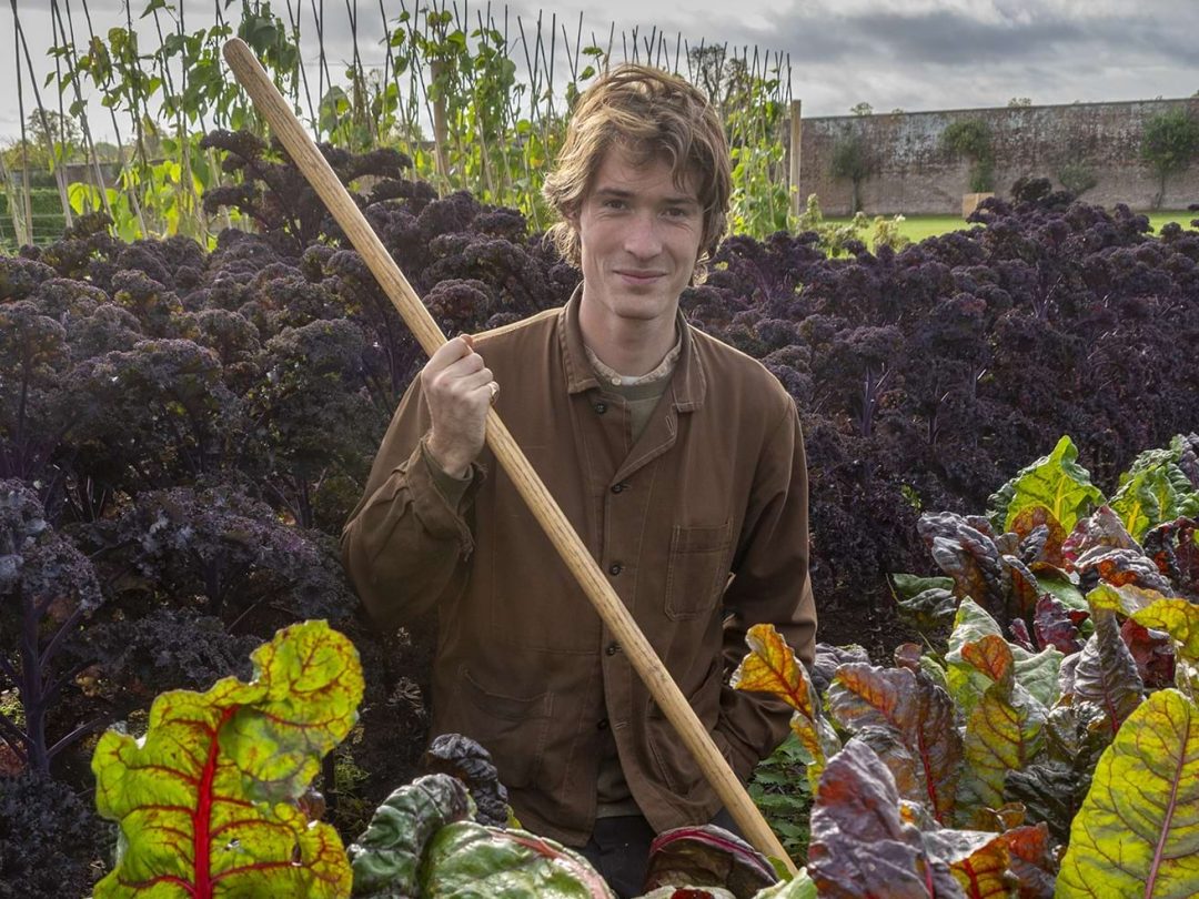 Harrison holding vegetables