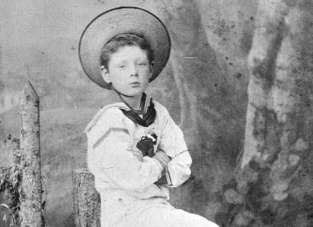A photograph of Winston Churchill as a young boy in a straw hat