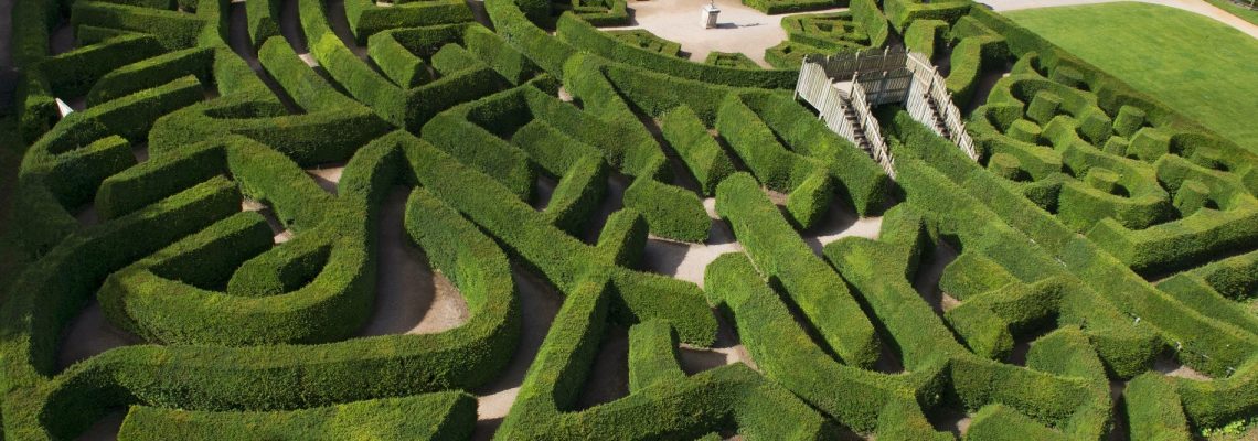 Aerial view of the hedge maze with its winding paths and a small raised viewing platform